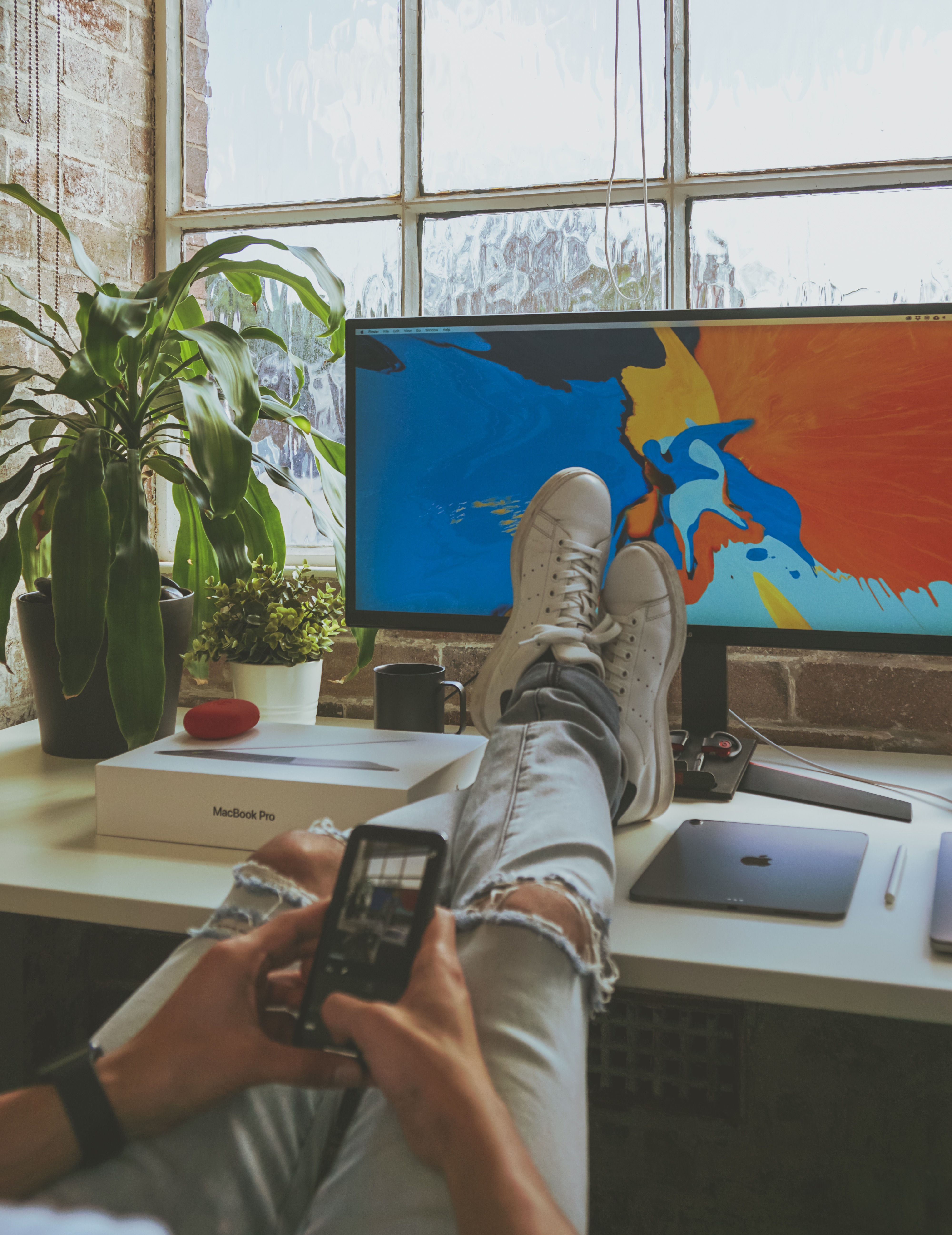 person taking a break from working remotely from home feet up relax